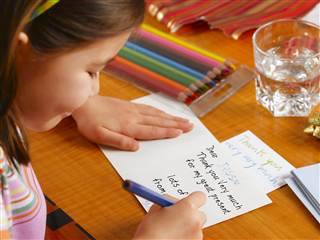 1B5669101-tdy-130122-kid-writing-letter.blocks_desktop_small
